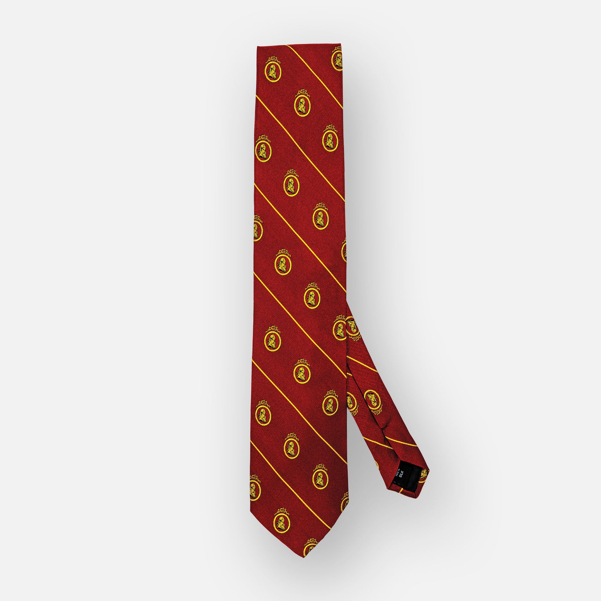 Red silk tie with thin gold stripes and gold portrait.
