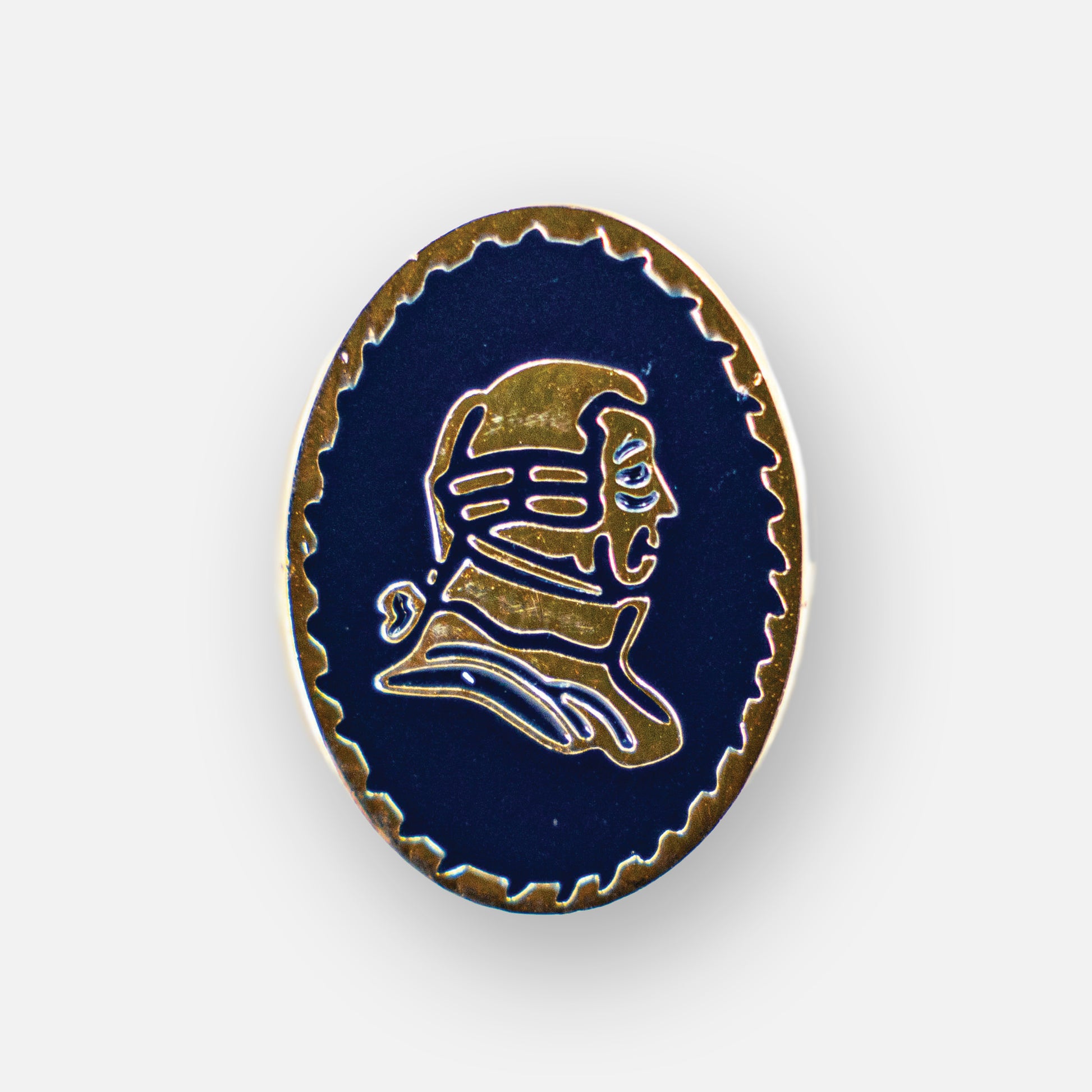 Lapel pin with blue background and gold portrait.
